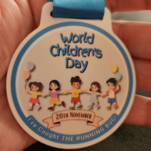 World Children's Day medal with cartoon children