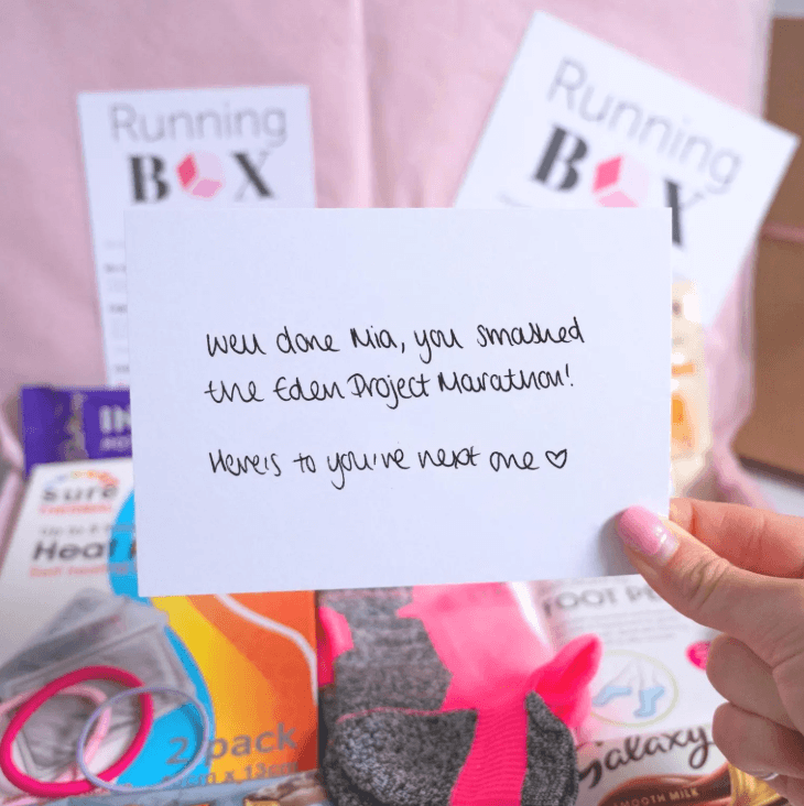 Handwritten marathon congratulations card with running gifts