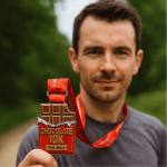 Runner proudly holding Chocolate 10K race medal after completing 10K run on 7th July