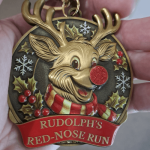 Rudolph Red-Nose Run medal with glitter nose