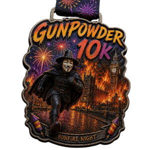 Gunpowder 10K Bonfire Night running medal featuring Guy Fawkes wearing a mask and cape, running in front of the burning Houses of Parliament and Big Ben with fireworks in the background.